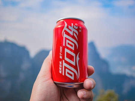 zhangjiajie/China - 15 october 2018: Tourist hold Coca Cola in chinese name with beautiful view on...