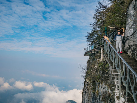 zhangjiajie/China - 15 october 2018: Unacquainted Tourists on Glass Cliff walk in tianmen mountain...