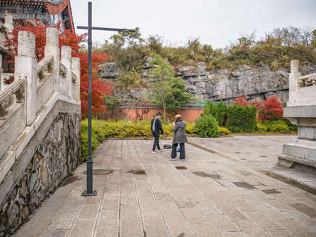 zhangjiajie/China - 15 October 2018:Unacquainted Tourists walking on tianmen temple on Tianmen mountain at Zhangjiajie China..Tianmen mountain the travel landmark of Hunan zhangjiajie city Chinaのeditorial素材