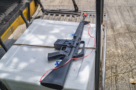 One Black Gun toy for Children with the Plastic rope bind on the gun