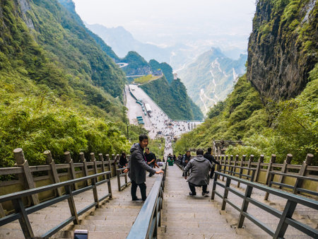 zhangjiajie/China-15 october 2018:Unacquainted Tourists climb up and down to heaven gate cave on heaven gate  stairs 999 step on tianmen mountain national park at Zhangjiajie city china.のeditorial素材