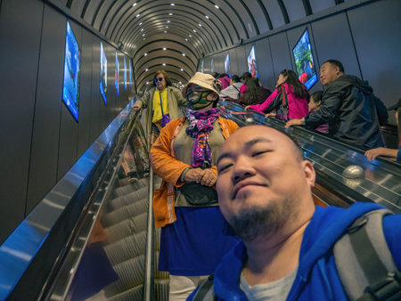 zhangjiajie/China - 15 october 2018:Unacquainted Tourists in tianmen mountain tunnels escalator to...