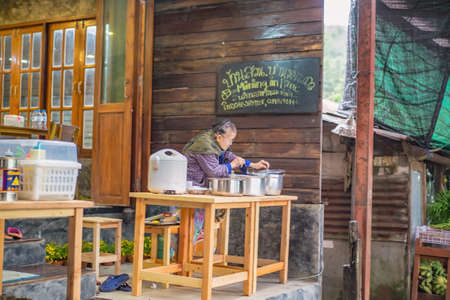 kanchanaburi/Thailand-1 July 2017:Unacquainted senior villager Selling traditional cuisine in Etong village at kanchanaburi city Thailand.Pilok mine The Old mine near the Thai-Myanmar borderのeditorial素材