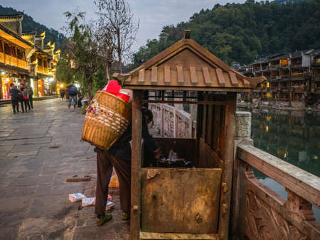 fenghuang,Hunan/China-16 October 2018:Unacquainted people walking in  fenghuang old town .phoenix ancient town or Fenghuang County is a county of Hunan Province, Chinaのeditorial素材