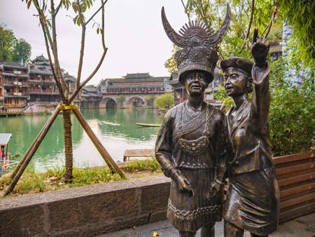 fenghuang,Hunan/China-16 October 2018:traditional woman statue in  fenghuang old town .phoenix ancient town or Fenghuang County is a county of Hunan Province, Chinaのeditorial素材