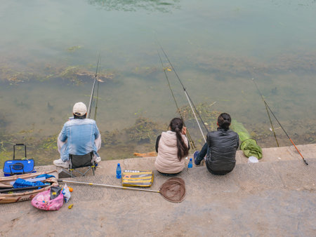 fenghuang,Hunan/China-16 October 2018:Unacquainted Chinese local people fishing in the river of...