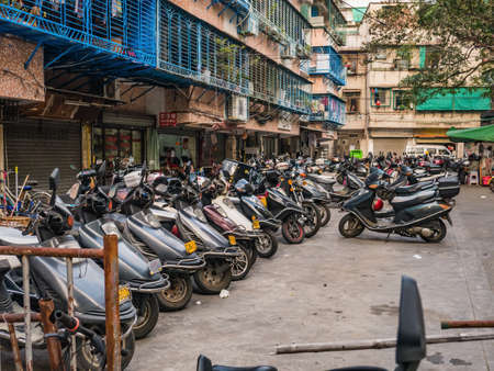 Shantou/china-30 march 2018:Chinese electric motorcycle parking downtown district at shantou city at china.electric motorcycle is the most famous automobile in chinaのeditorial素材