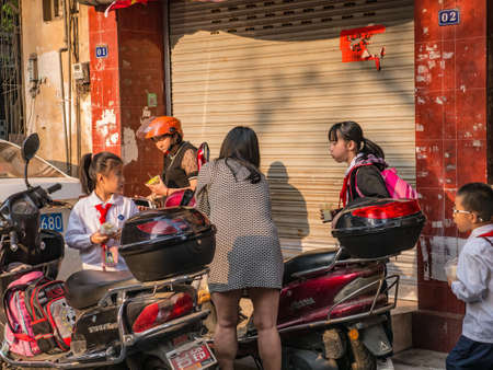 shantou/china-02 April 2018:Unacquainted Chinese Children and parent in the morning at downtown of shantou City China.Shantou city of Teochew people in Guangdong province Chinaのeditorial素材