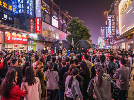Changsha/China-17 October 2018:Unacquainted street performers singing at huangxing walking street in...
