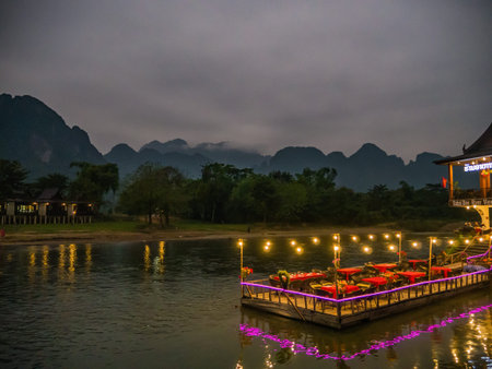 Vangvieng/lao-4 Dec 2017:Beautiful view of nam song river with riverside restaurant and the mountain...