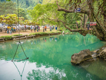 Vangvieng/lao-10 Dec 2017:Tourist with Beautiful nature and clear water of lagoon at pukham cave vangvieng city Lao.Vangvieng City The famous holiday destination town in Lao.のeditorial素材