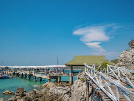 Tourist with Tropical Ocean and Boat on Koh lan Island in vacation time. Koh lan island is the Famous island near Pattaya city the Travel Destination in Thailand.の写真素材