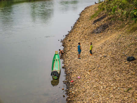 Vangvieng/lao-10 Dec 2017:Unacquainted Local people Playing beside riverside of Nam Song River  at Tham Chang cave Vangvieng City Laos.Vangvieng City The famous holiday destination town in Lao.のeditorial素材