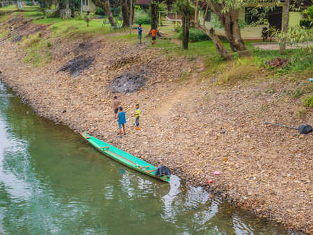Vangvieng/lao-10 Dec 2017:Unacquainted Local people Playing beside riverside of Nam Song River  at Tham Chang cave Vangvieng City Laos.Vangvieng City The famous holiday destination town in Lao.のeditorial素材