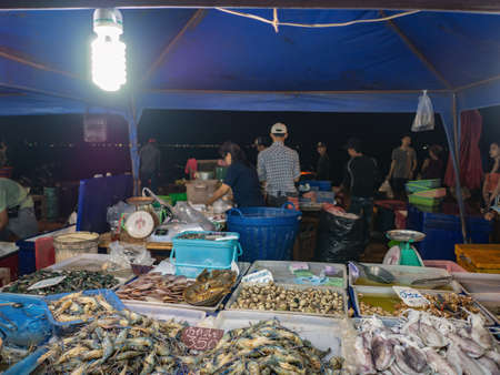 Chonburi/Thailand - 20 apr 2019:Unacquainted people selling street food at night market on koh lan island Pattaya Thailand.のeditorial素材