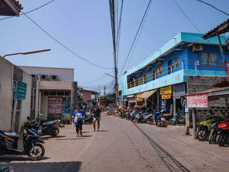 Chonburi/Thailand -21 apr 2019:Unacquainted tourist walking at downtown of koh larn island Pattaya chonburi city Thailand.Rent motorcycle shop on koh larn island.のeditorial素材