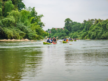 Vangvieng/lao-10 Dec 2017::Unacquainted tourist kayaking on namsong river at vangvieng city Laos.Vangvieng City The famous holiday destination town in Lao.のeditorial素材