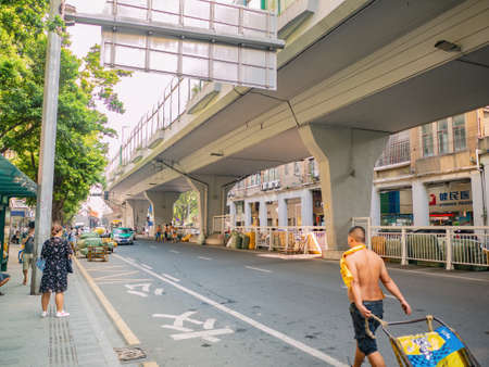 Guangzhou/China-24 Aug 2019::Unacquainted worker Push the cart in front of Shisanhang Clothing Wholesale Marke at guangzhou china.Shisanhang Clothing Wholesale Market is a huge clothes marketのeditorial素材