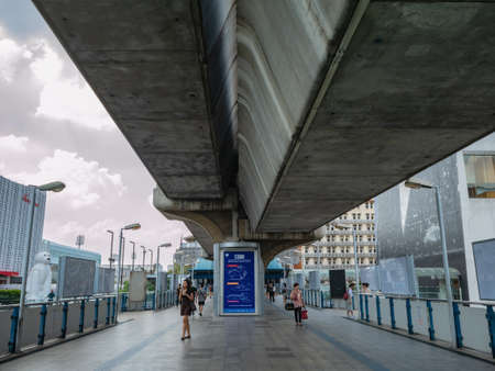Bangkok/thailand- 26 Oct 2019:Unacquainted tourist walking on  skywalk under the BTS sky train at Bangkok city Thailand.Bangkok city The capital of Thailandのeditorial素材