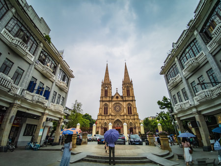 Guangzhou/China-25 Aug 2019:Tourist Take photo with Sacred Heart Cathedral at guangzhou china.The Sacred Heart Cathedral is a Catholic church in the Diocese of Guangzhouのeditorial素材