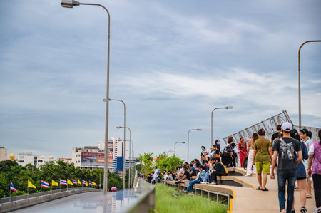 Bangkok/Thailand- 04/07/2020-Unacquainted people on chao phraya skypark.The elevated Chao Phraya...