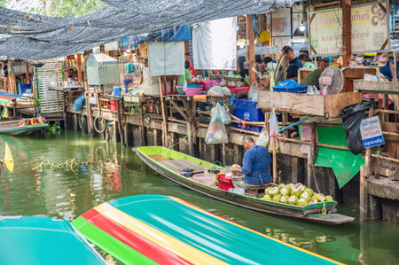 Bangkok/Thailand-12/07/2020-Unacquainted people on the boat at Ladmayom Floating Market.Khlong Lat...