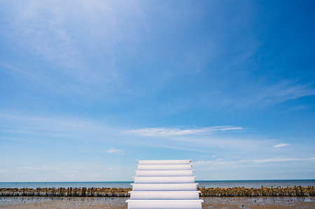 Beautiful seascape and blue sky with white staircase to the sky beside the sea in thailand.の写真素材