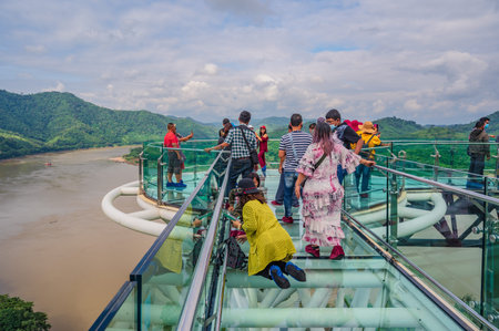 Loei-thailand-23 oct 2020:Unacquainted tourist walking on Chiangkhan Glass skywalk at  Phu khok ngio...
