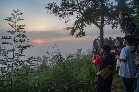 loei-Thailand-24 oct 2020:Unacquainted People waiting for sunrise on phu thok  at chiang khan in the early moring.Chiang Khan is an old town and a very popular destination for Thai touristsのeditorial素材