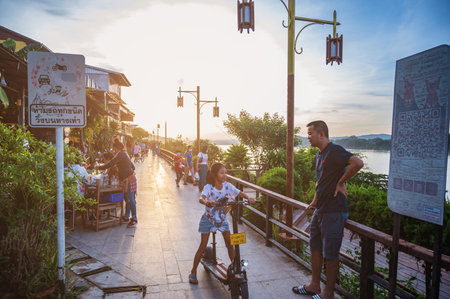 loei-Thailand-24 oct 2020:Unacquainted People walking on Chiang khan riverside with landscape view of maeklong river at loei thailand.Chiang Khan is an old town and a very popular destination for Thai touristsのeditorial素材