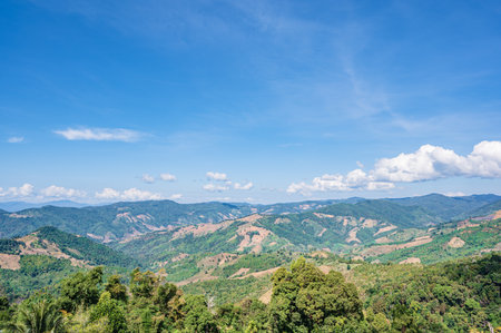 Beautiful mountain view and blue sky on doi sky at nan province.Nan is a rural province in northern Thailand bordering Laosの写真素材