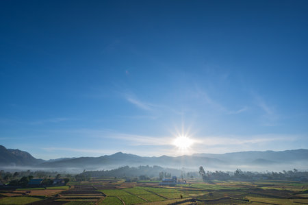 Landscape view of sunrise in the early morning and  sea of mist cover the mountian on the wat phuket temple viewpoint pua District nan.Pua  in the central part of Nan Province, northern Thailandの写真素材