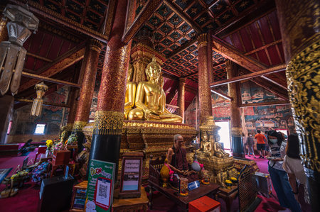 Nan.thailand-19.12.2021:Golden buddha statue in Wat Phumin at nan city thailand.Wat Phumin is the most attractive temple in the town of Nan.のeditorial素材