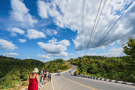 Nan.thailand-19.12.2021:Road No.1081 way from Pua District to Bo Kluea District, Nan THAILAND.The famous view point and that tourists must stop by to check in at nan. Curvy road looks like number 3.のeditorial素材