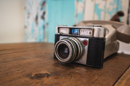 Old and dirty vintage film camera on the wooden tableの写真素材