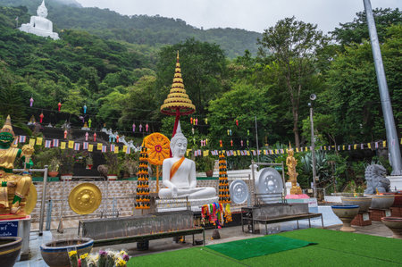 Nakhon Ratchasima..Thailand 13.07.2022.White buddha statue on the mountain in Wat Thep Phithak Punnaram temple Nakhon Ratchasima.のeditorial素材
