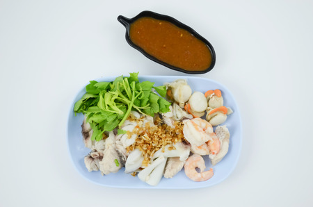 Boiled Seafood with sauce isolate on white backgroundの写真素材