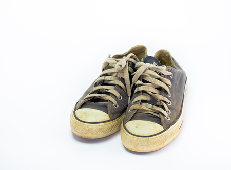 close up Dirty shoe on isolate white background , close up shoe,dirty blue shoes on the white background , canvas blue shoes ,old shoe,sneaker shoeの写真素材