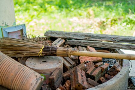 the broom and the redblock  in the cement circleの写真素材