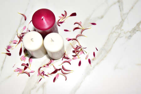 red and white candles on marble backgroundの写真素材
