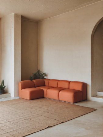 Interior of a modern living room with orange sofa and plants.の素材