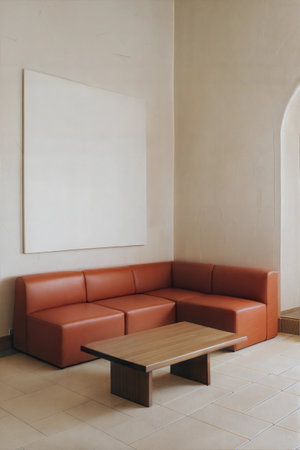 Interior of a hotel lobby with a brown sofa and a white posterの素材