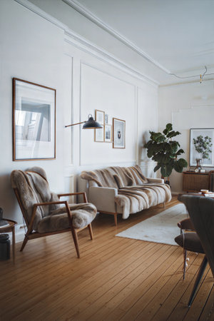 interior of modern living room with beige sofa and armchairsの素材