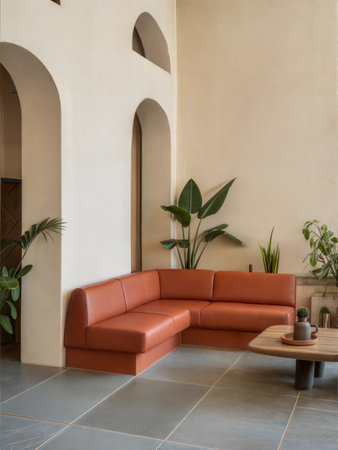 Interior of a modern living room with a brown sofa and plantsの素材