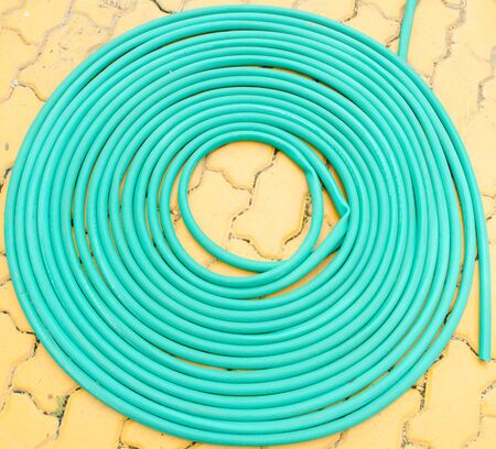 Rubber tube on the floorの写真素材