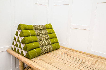 Triangle Pillow a tradition native Thai style pillow,on litterの写真素材