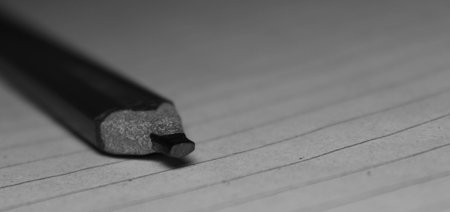 A rectangular graphite pencil on the paperの写真素材