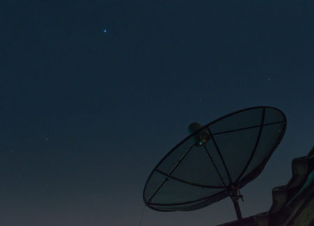 communication Satellite dish blue sky background  and star