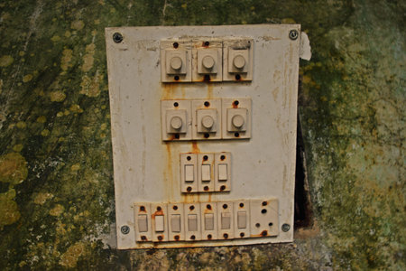 Old electric switch on the roof of a house. Old electrical equipment.