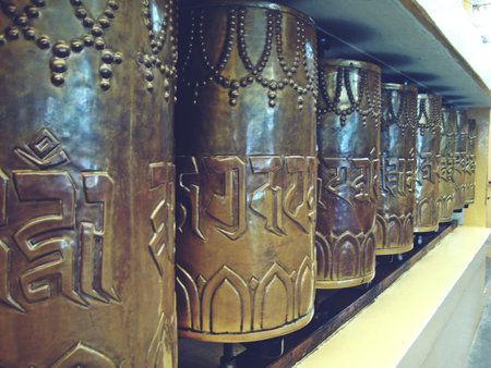 Prayer wheels in a Buddhist temple.の写真素材